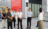潜江市委常委、统战部部长王绪军一行到我校调研 校党委书记刘子林陪同